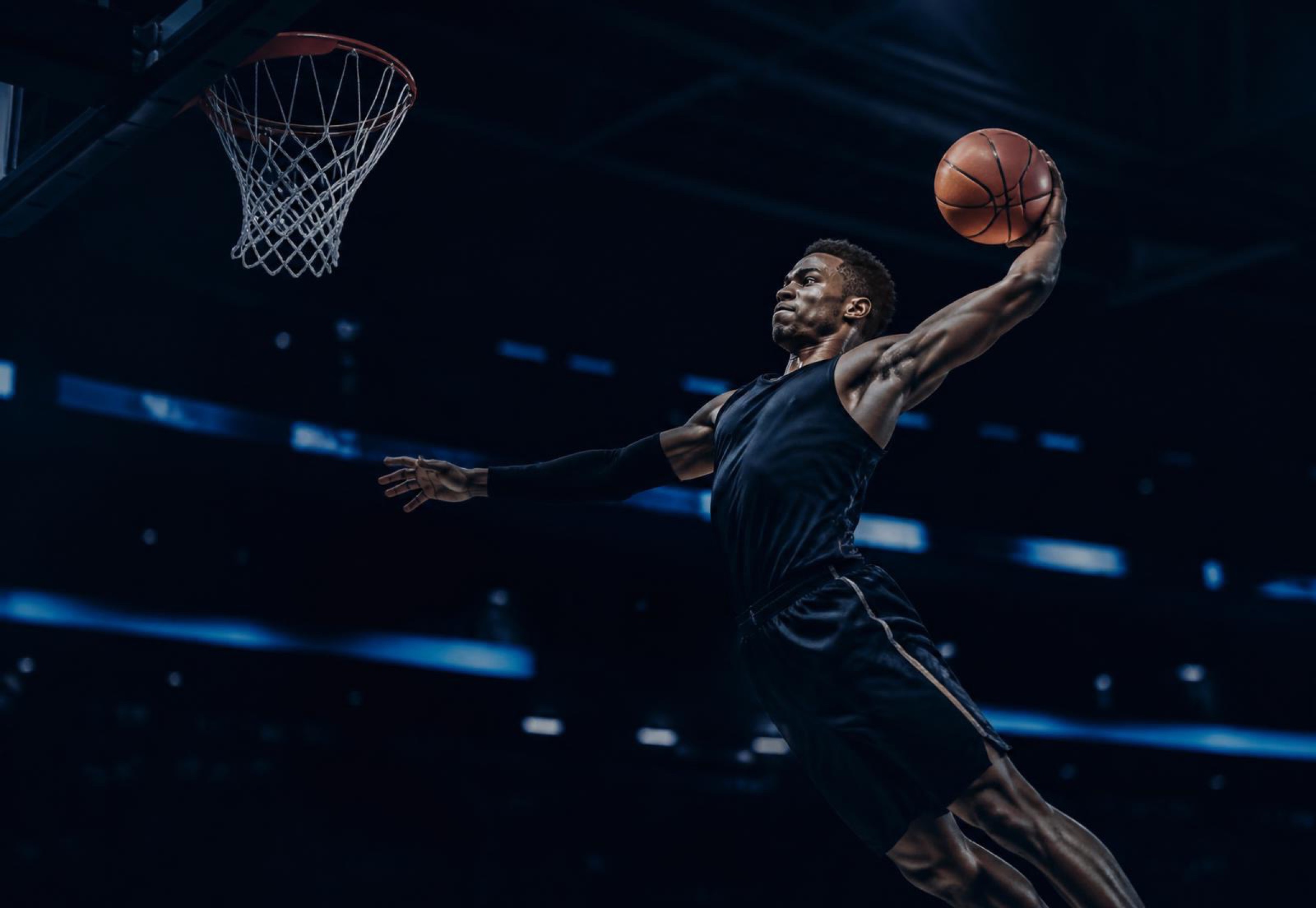 A basketball player rising for a dunk, program-wide athlete visibility measured by Virtus